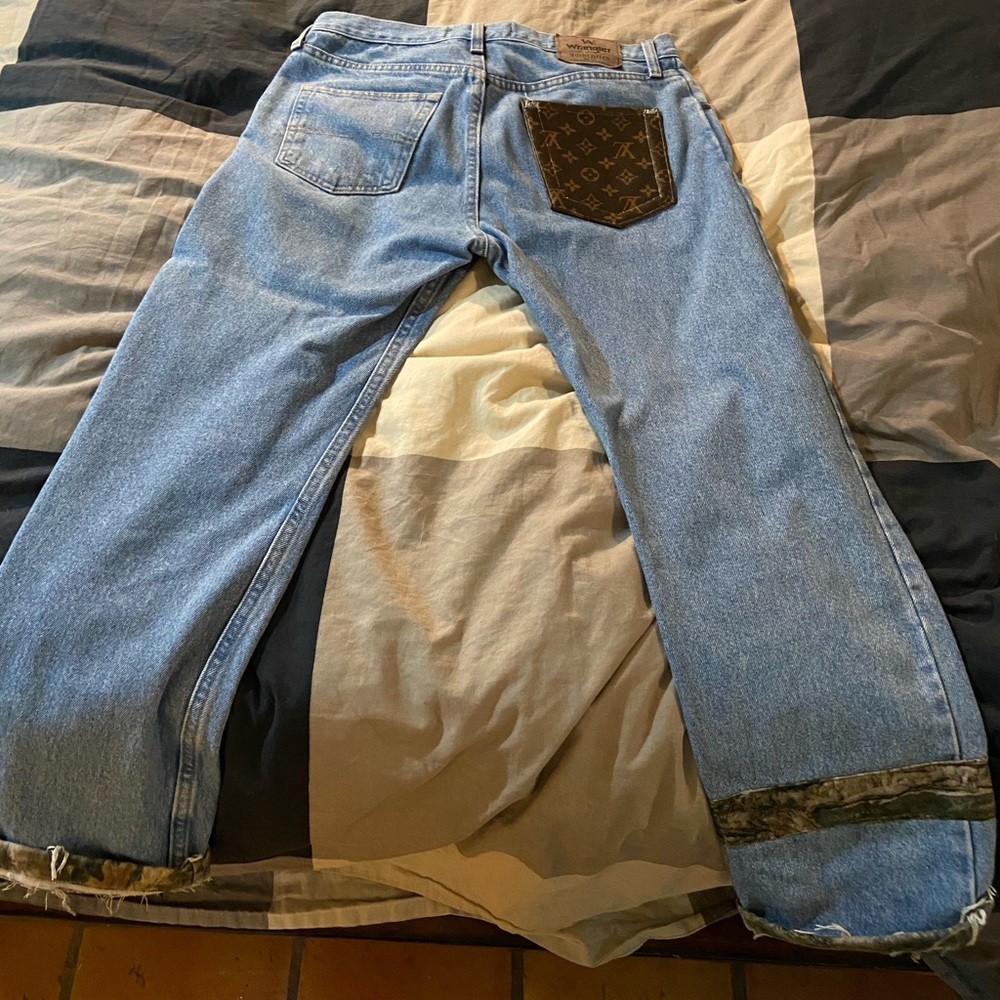 Louis Vuitton light wash custom wrangler jeans